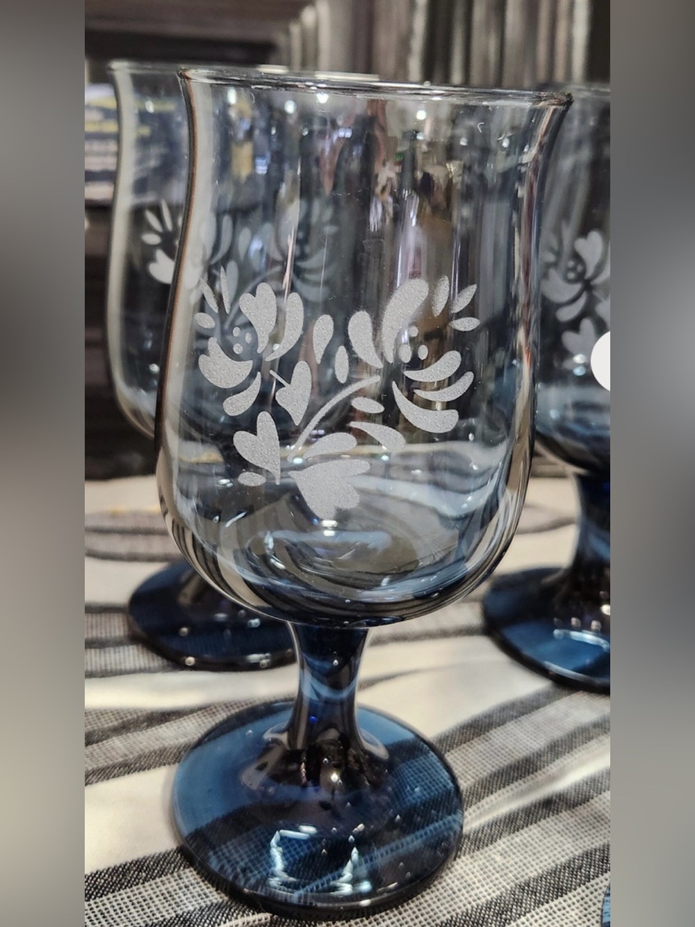 Vintage blue glass goblet with etched floral designs by Pfaltzgraff.